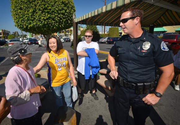 Commander Bill Collins of the Westminster Police Department walks through Phước Lộc Thọ (Phuc Loc Tho) known in English as Asian Garden Mall, the first Vietnamese-American business center in Little Saigon, as he connects with the people who work and visit the community.